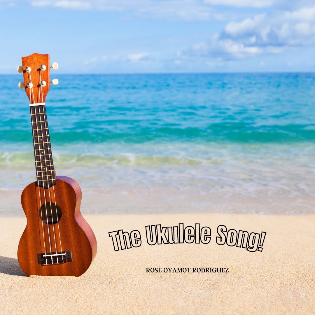 A ukulele on a beach. Text reads: The Ukulele Song followed by the writer's name: ROSE OYAMOT RODRIGUEZ