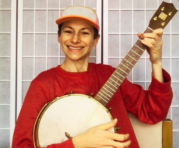 Ingrid, Ms Christina, in a cap; wearing a red top; and playing the banjo!